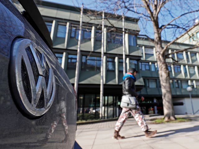 A VW (Volkswagen) logo on a car seen in front of the Higher Regional Court (OLG) in Stuttgart