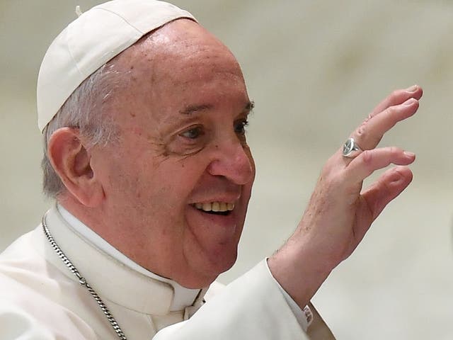 Pope Francis gestures during an audience with teachers and students of the San Carlo Institute in Milan