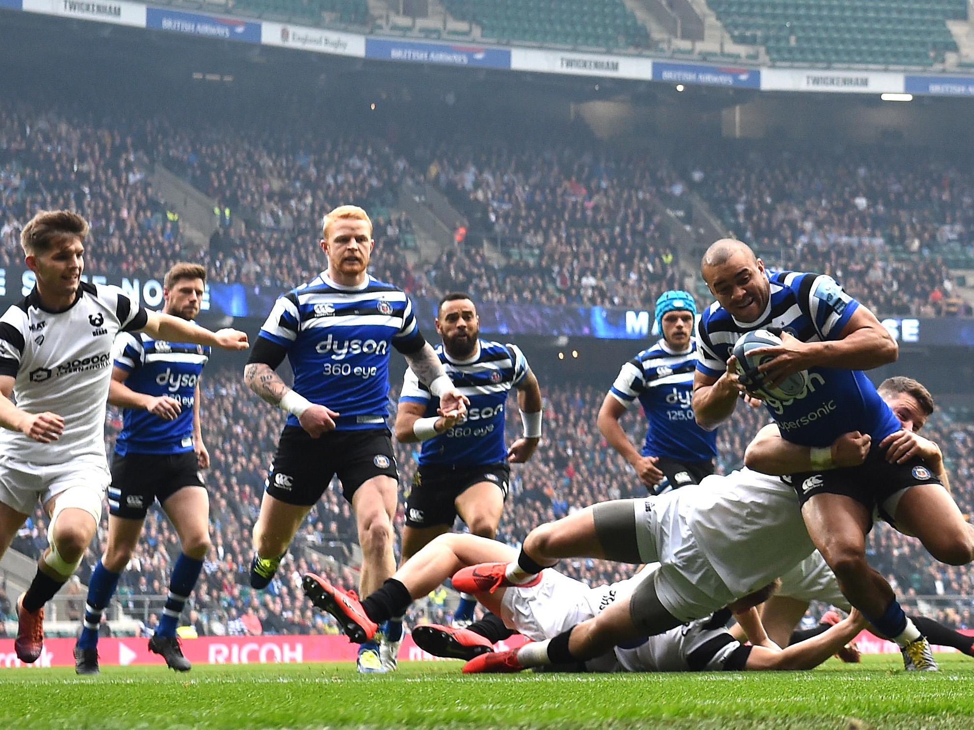 Jonathan Joseph escapes the challenge of Luke Daniels to touch down for Bath