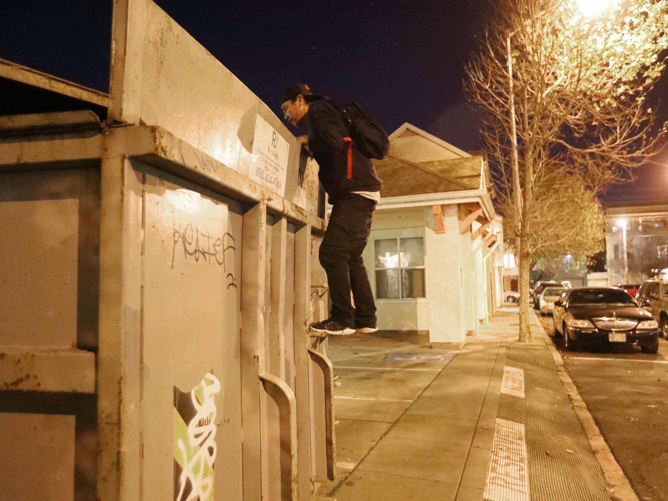 Jake Orta peers into a dumpster in San Francisco on 25 Jan, 2019