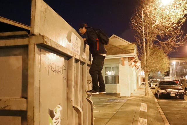 Jake Orta peers into a dumpster in San Francisco on 25 Jan, 2019