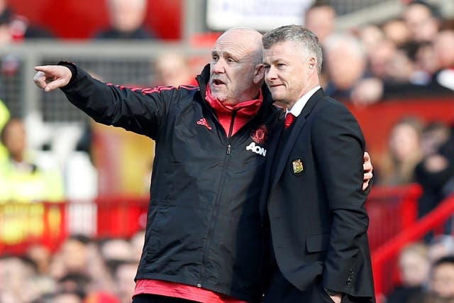 Manchester United manager Ole Gunnar Solskjaer and assistant coach Mike Phelan