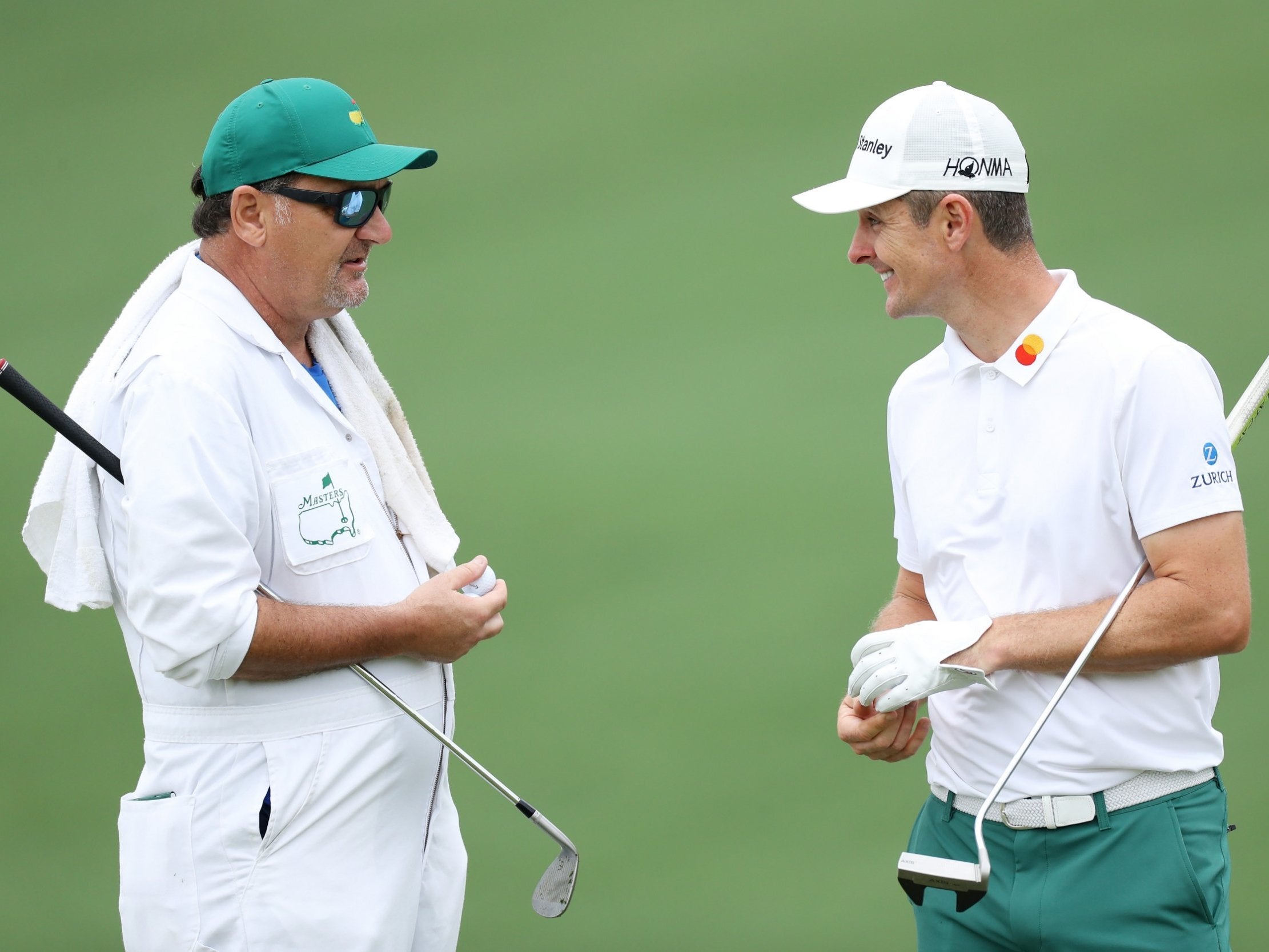 Justin Rose chats with caddie Mark Fulcher