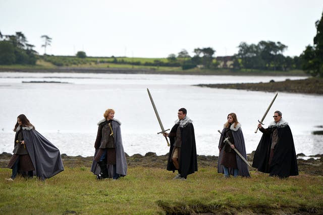 Scene stealer: tourists walk along Strangford Lough on a ‘Game of Thrones’ tour trail