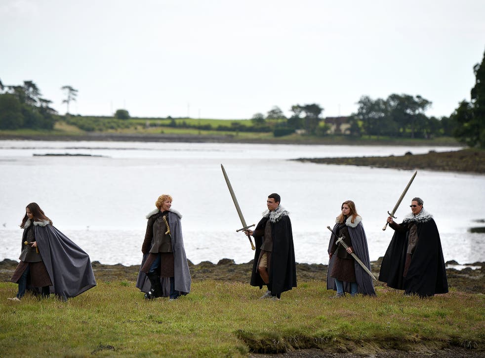 Scene stealer: tourists walk along Strangford Lough on a ‘Game of Thrones’ tour trail
