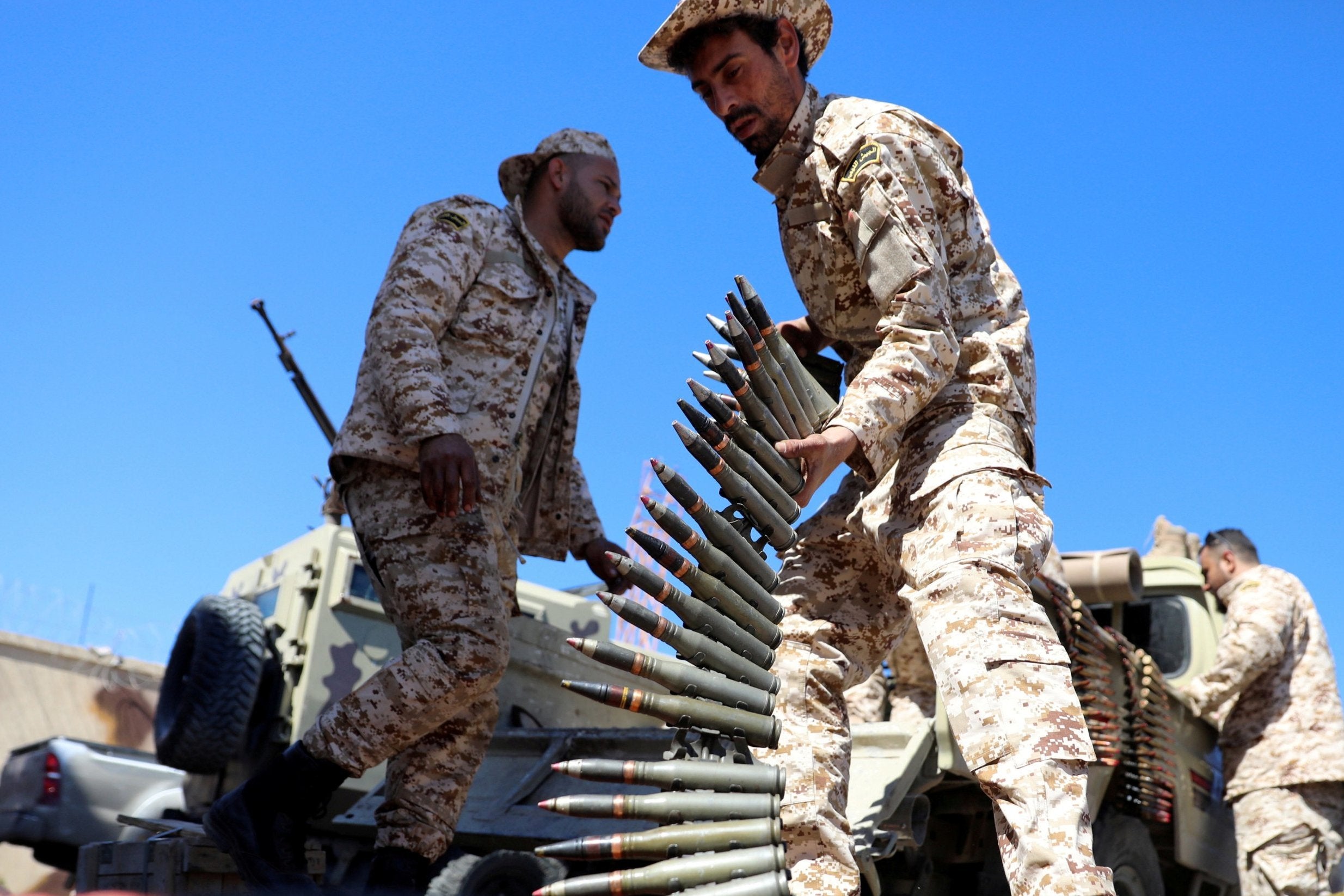 A member of Misrata forces prepares himself to go to the front line in Tripoli on Monday