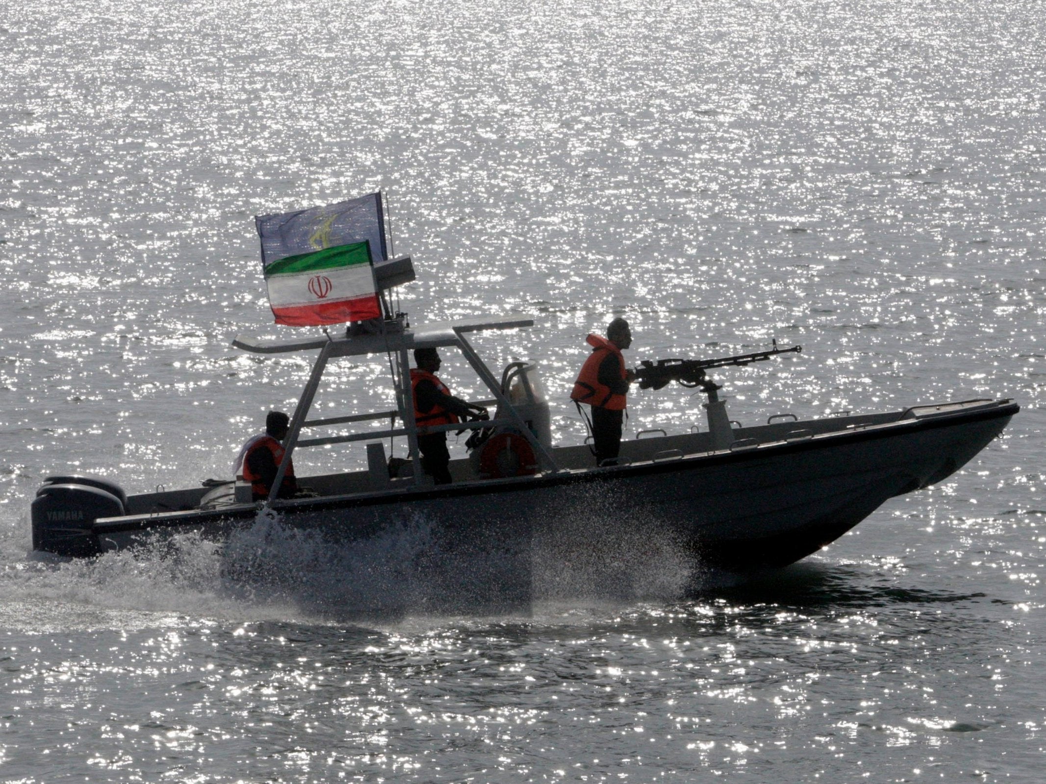 An Iranian Revolutionary Guard speedboat participates in a 2012 ceremony remembering 290 passengers of an Iranian airliner downed by a US warship in 1988