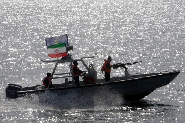 An Iranian Revolutionary Guard speedboat participates in a 2012 ceremony remembering 290 passengers of an Iranian airliner downed by a US warship in 1988