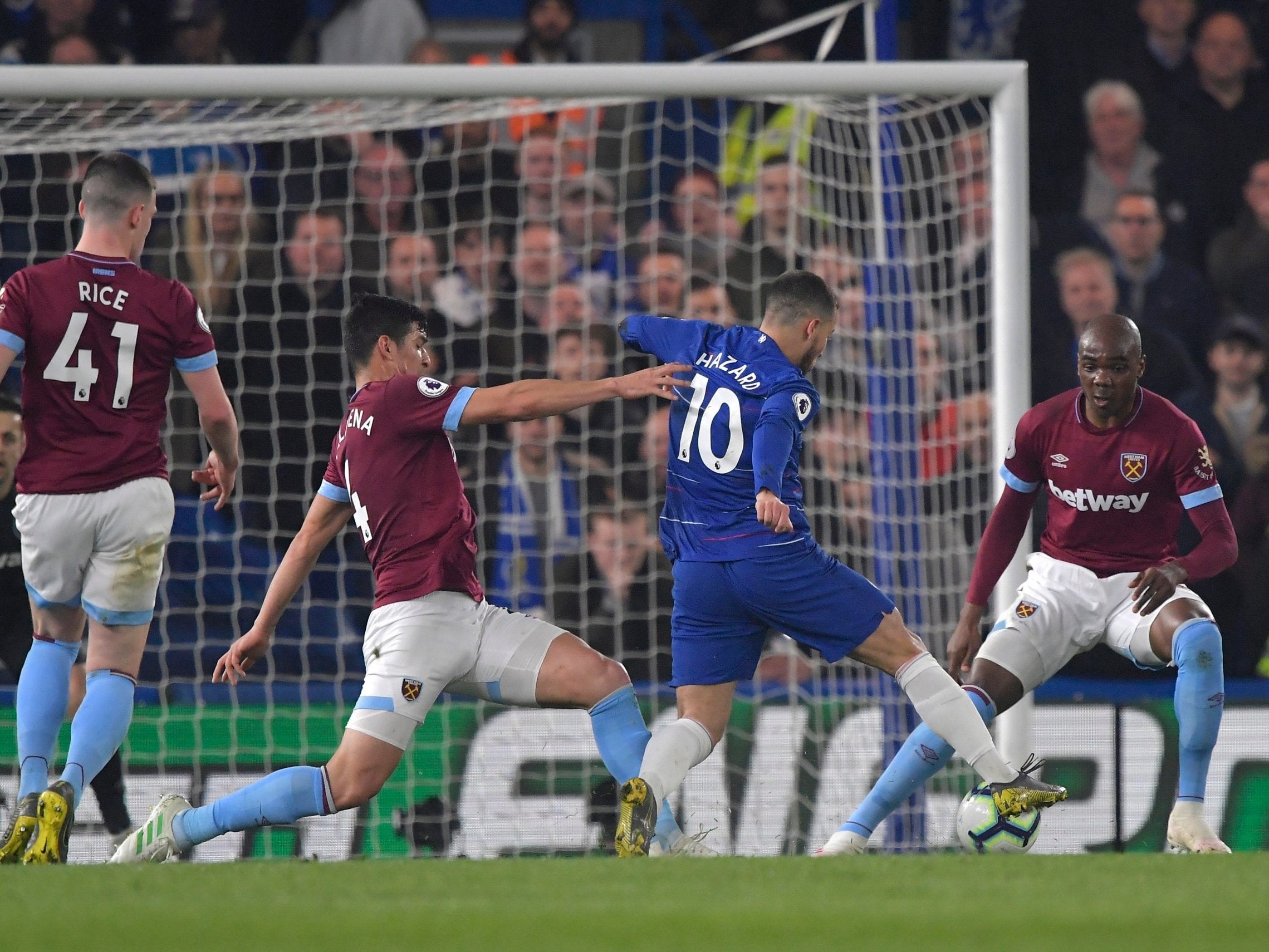 Eden Hazard cuts between two defenders on route to goal