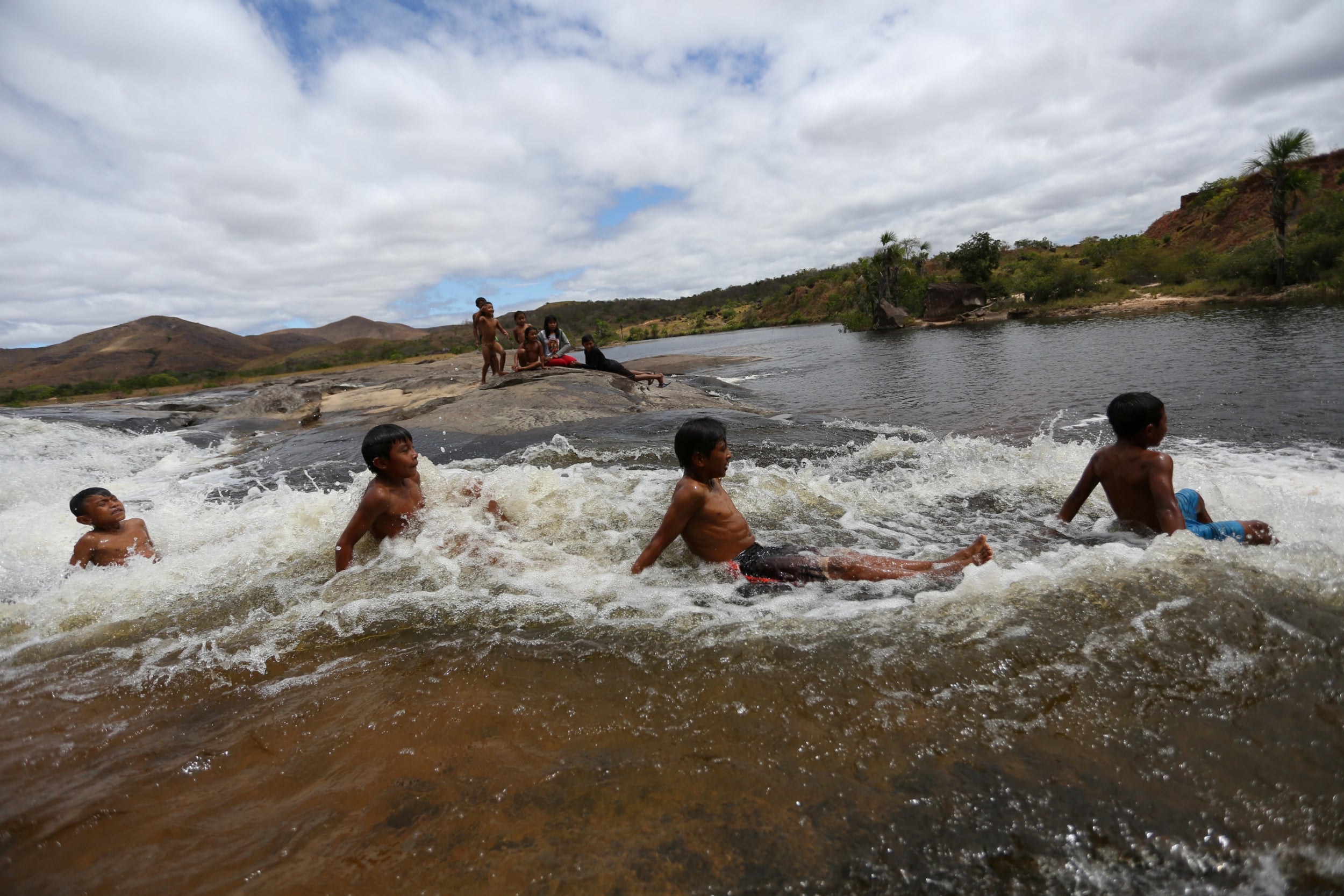 Children play in Uailan river in Romaira state