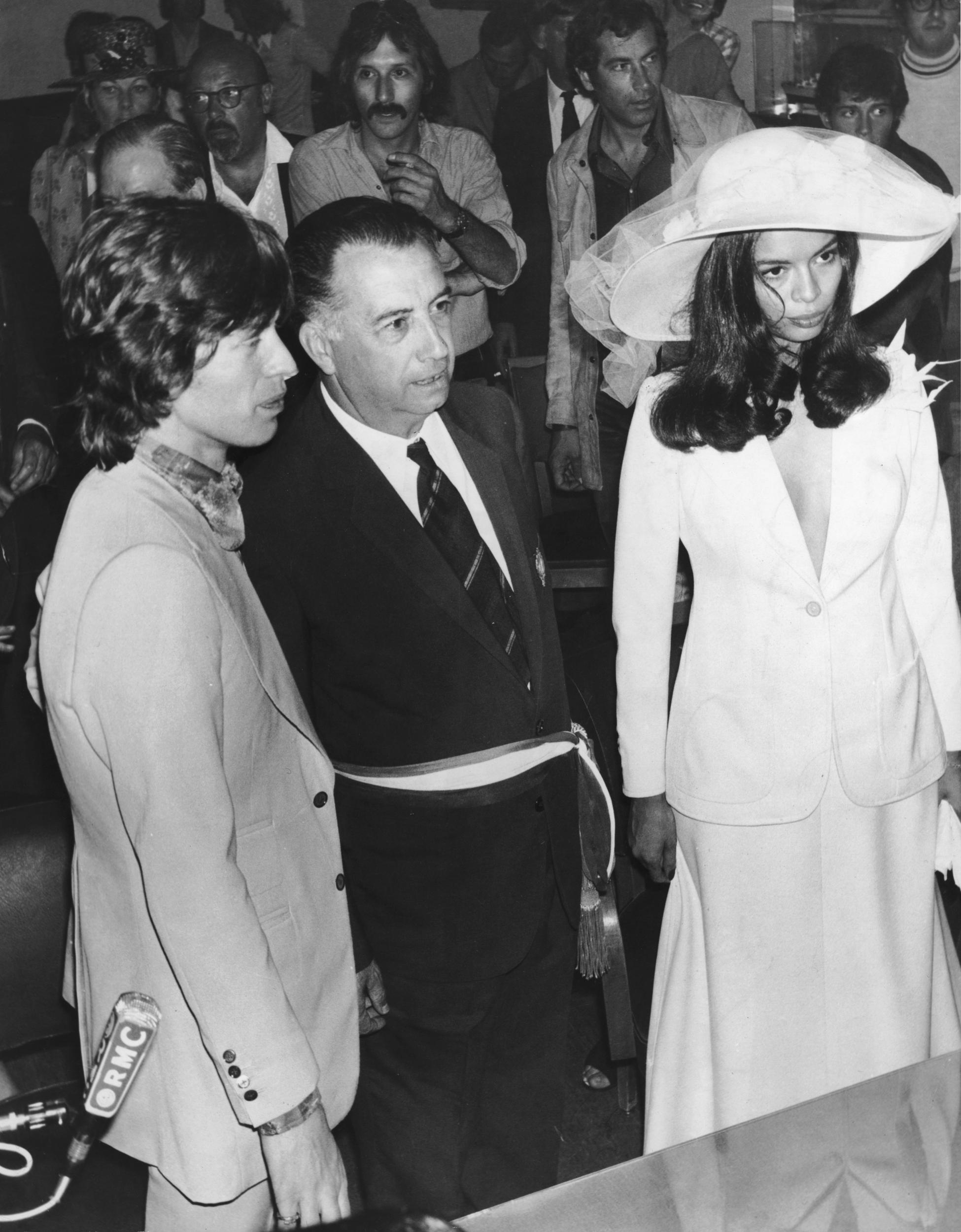 Marius Astezan, the Mayor of Saint-Tropez, stands between Rolling Stones singer Mick Jagger and his new bride Bianca Perez Morena de Macias during their wedding at Saint-Tropez Town Hall, 12th May 1971