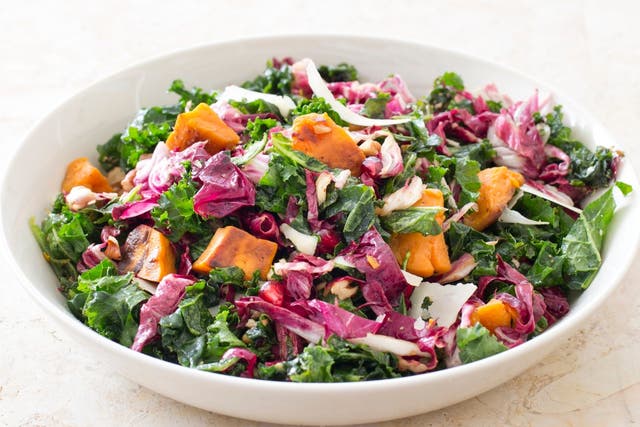Pictured: kale salad with sweet potatoes. The study alleges women are drawn to healthy food, while men more likely to spend their money on vitamins, protein powders and exercise supplements.