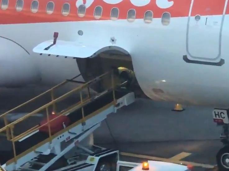 Baggage handler at Manchester airport does press ups in plane cargo hold The Independent The Independent