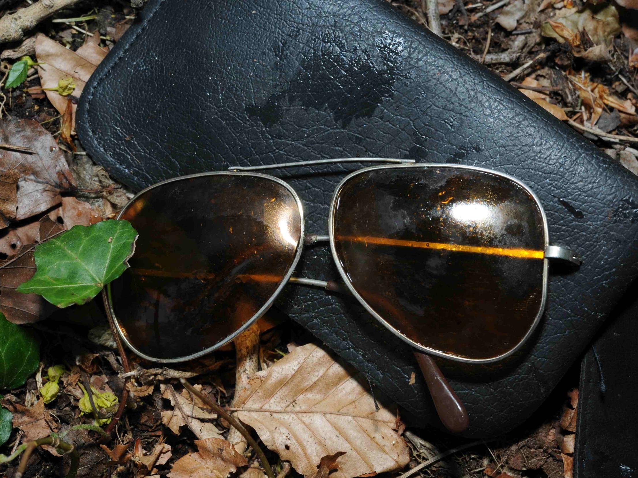 Sunglasses found next to unidentified dead man