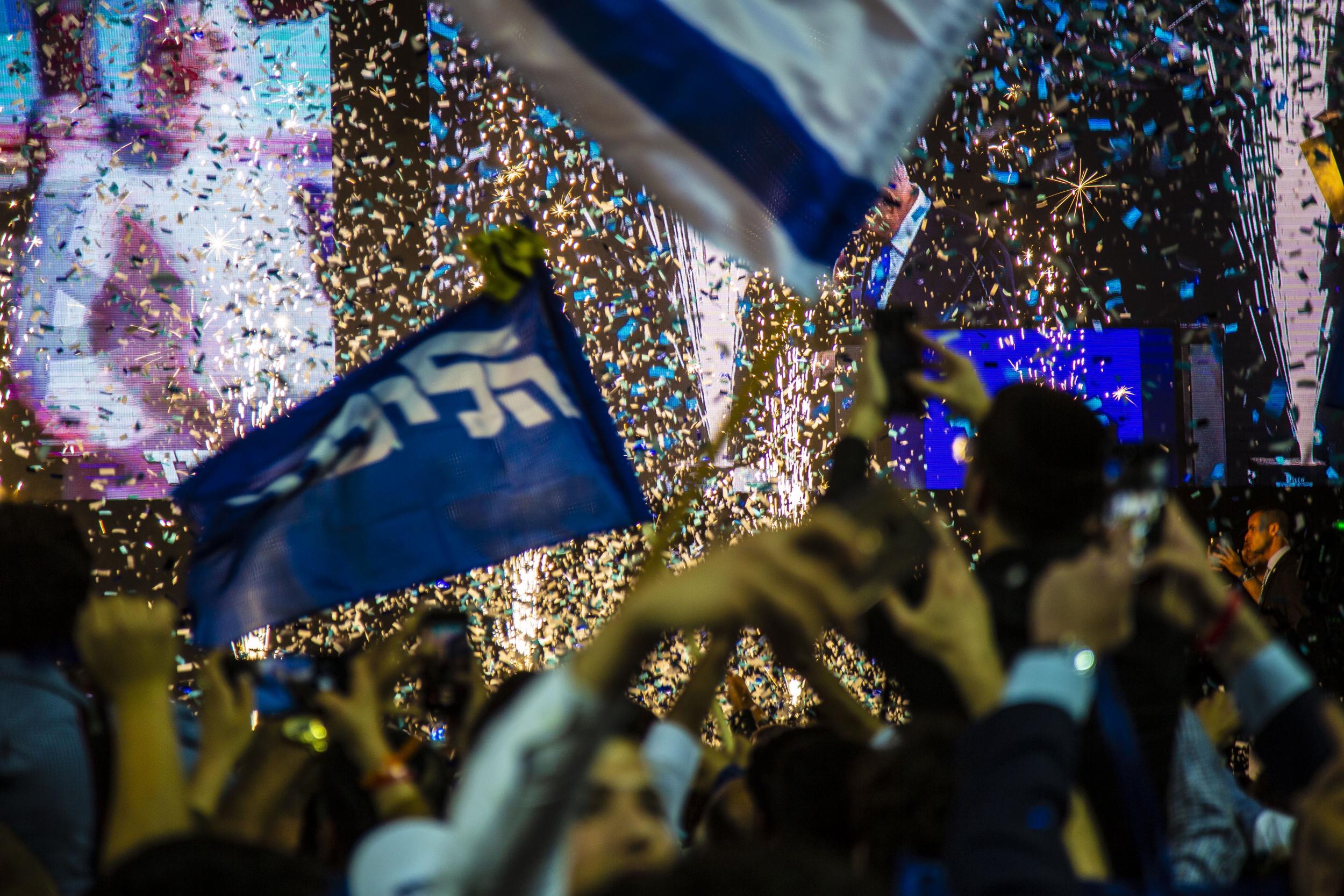 Netanyahu's supporters celebrate what he said was a Likud win at their headquarters in Tel Aviv