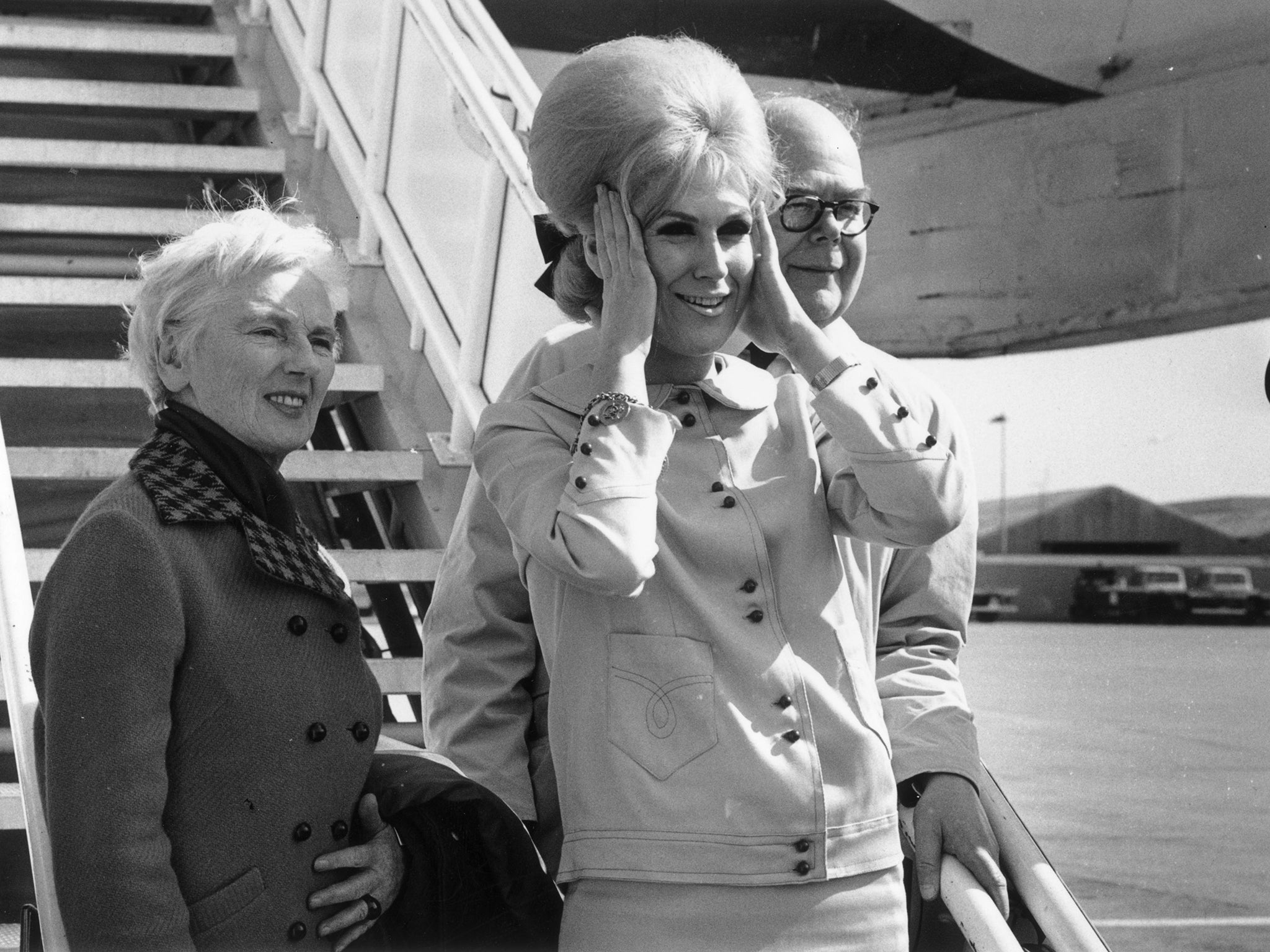 At London airport in 1964, boarding a plane for New York with parents Kay and Gerard