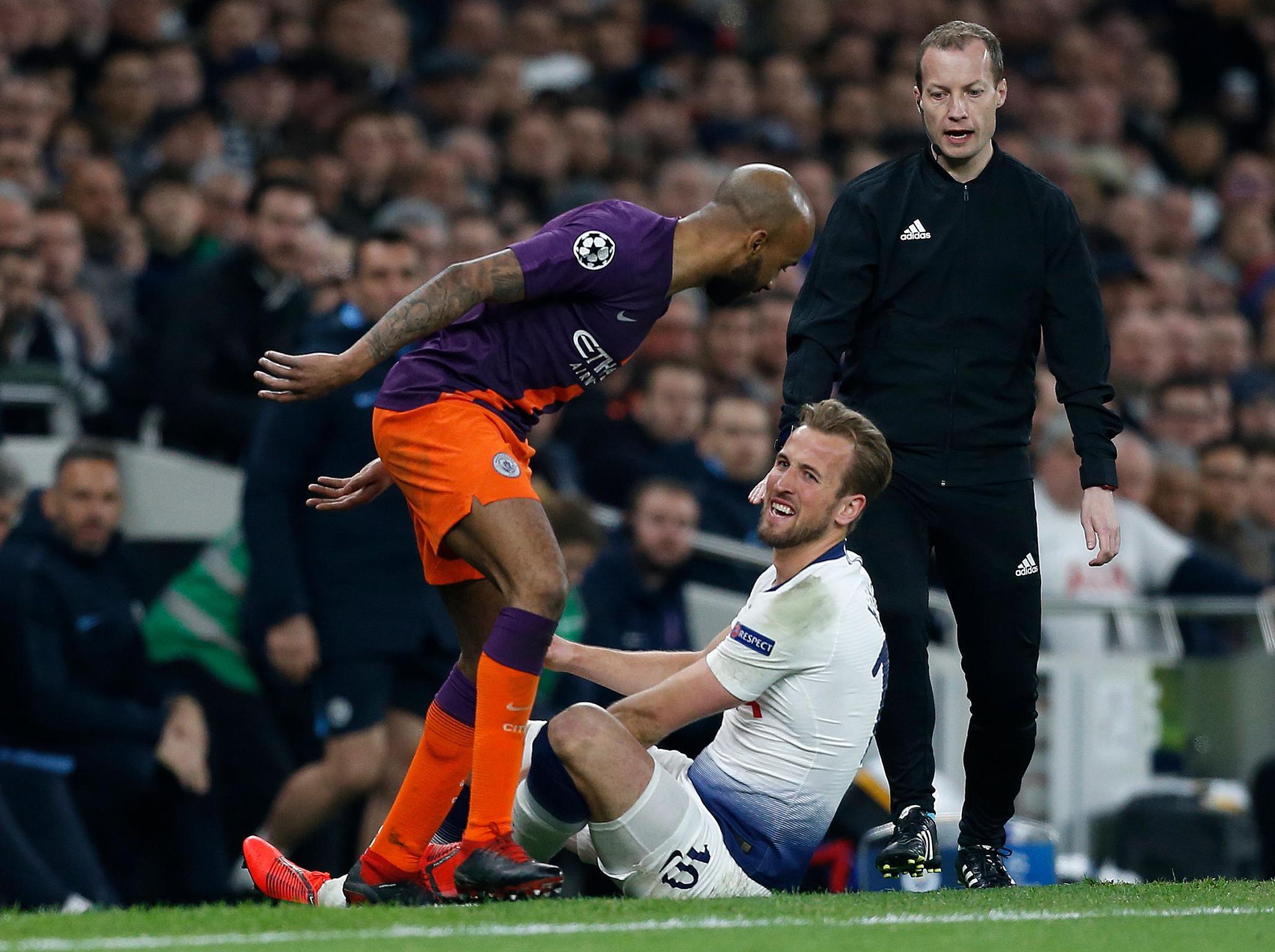 Harry Kane reacts after a challenge with Fabian Delph