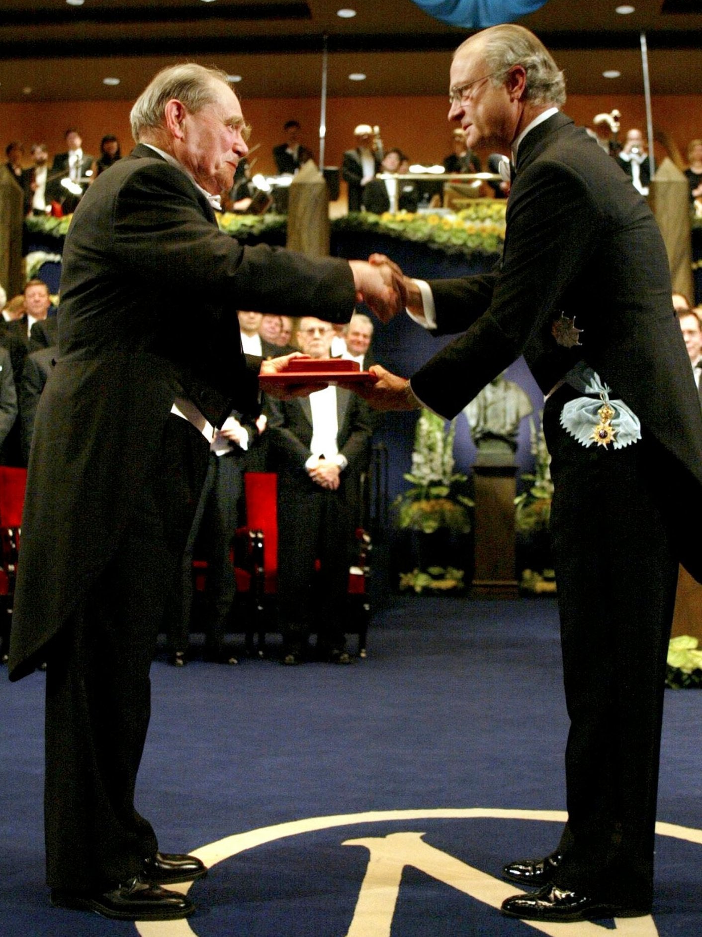 Receiving the 2002 Nobel prize from King Carl Gustaf of Sweden
