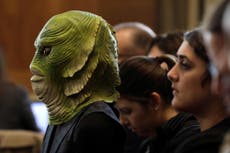 Activists in swamp monster masks deliver petition to Mitch McConnell
