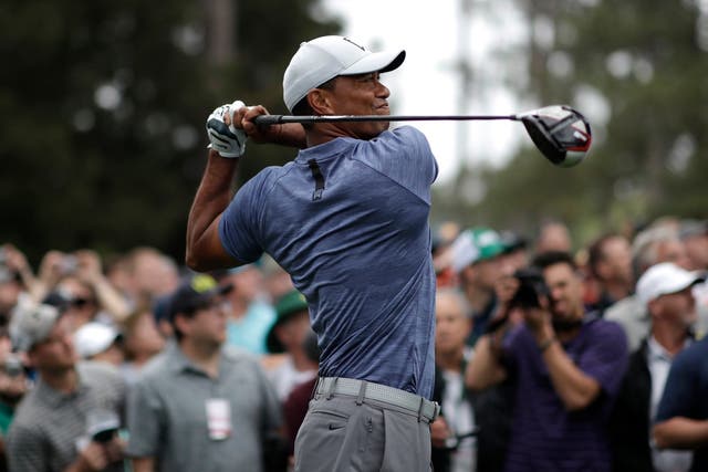 Tiger Woods hits off the 17th tee