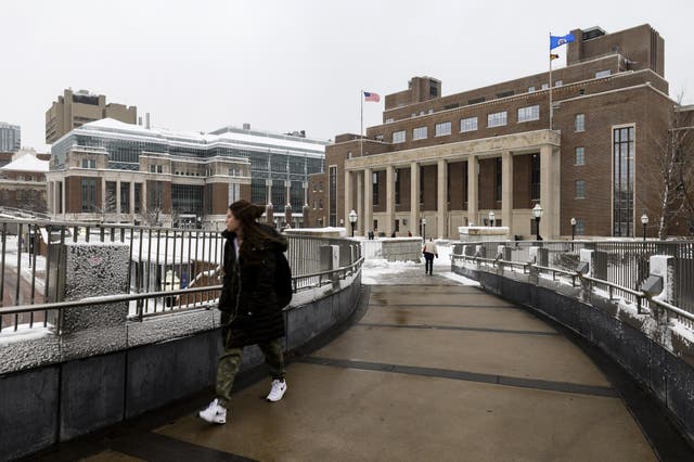A pedestrian passes by on the University of Minnesota campus on 11 April.