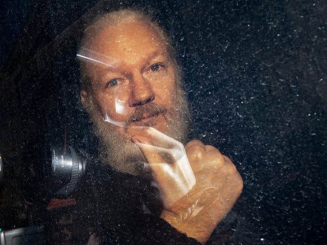 WikiLeaks founder Julian Assange arrives at Westminster Magistrates' Court in London after his arrest on 11 April 2019.