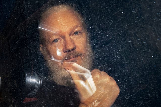 WikiLeaks founder Julian Assange arrives at Westminster Magistrates' Court in London after his arrest on 11 April 2019.