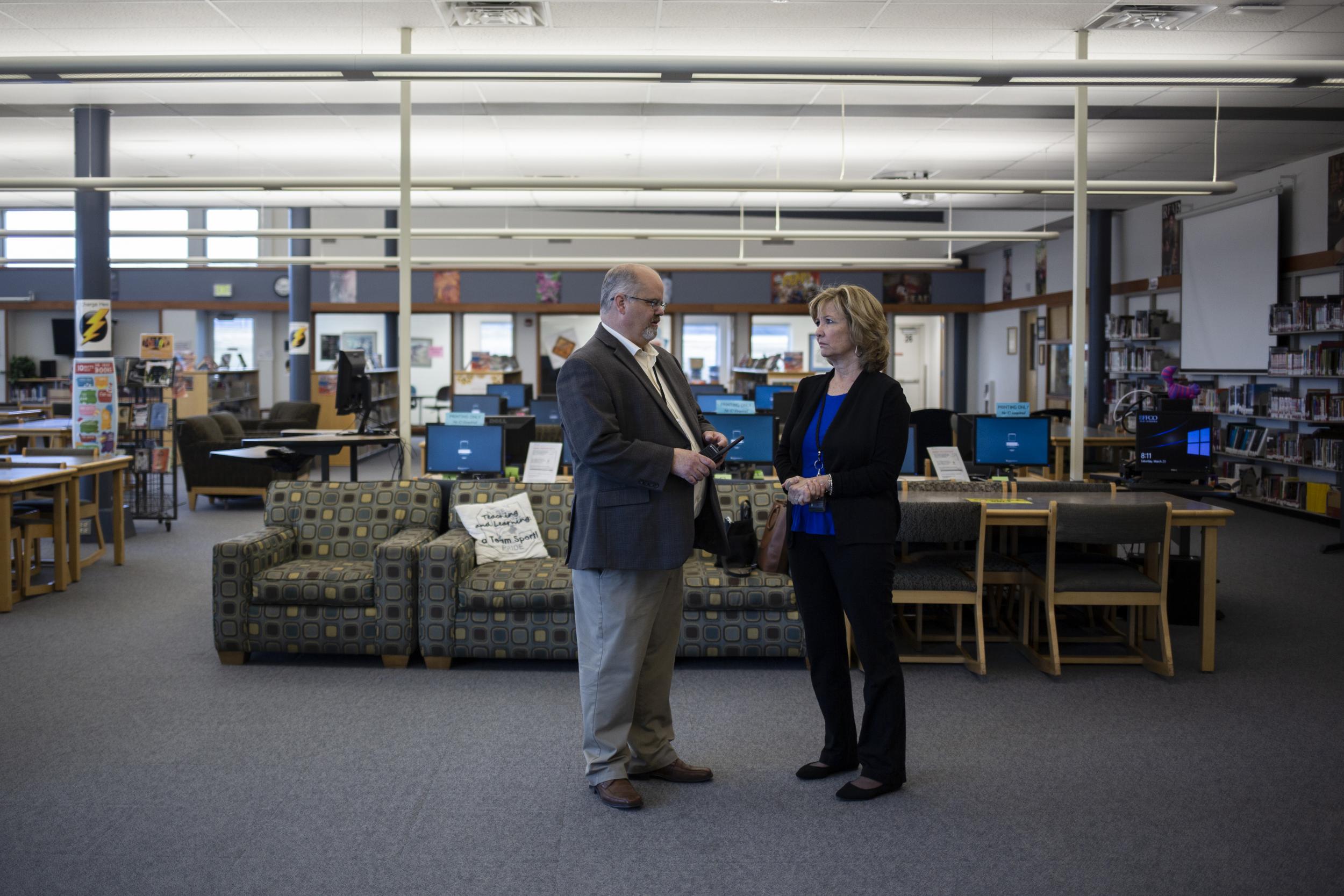 McDonald talks with judicial specialist Maryann Peratt in Columbine High School’s new library, which was built after the attack