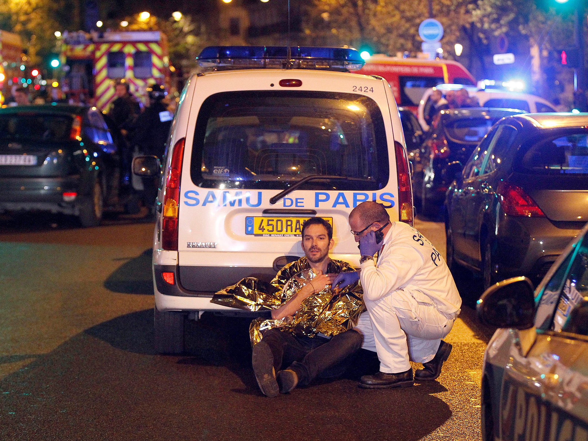 A medic tends to a man after the November 2015 Paris terrorist attacks (Getty)