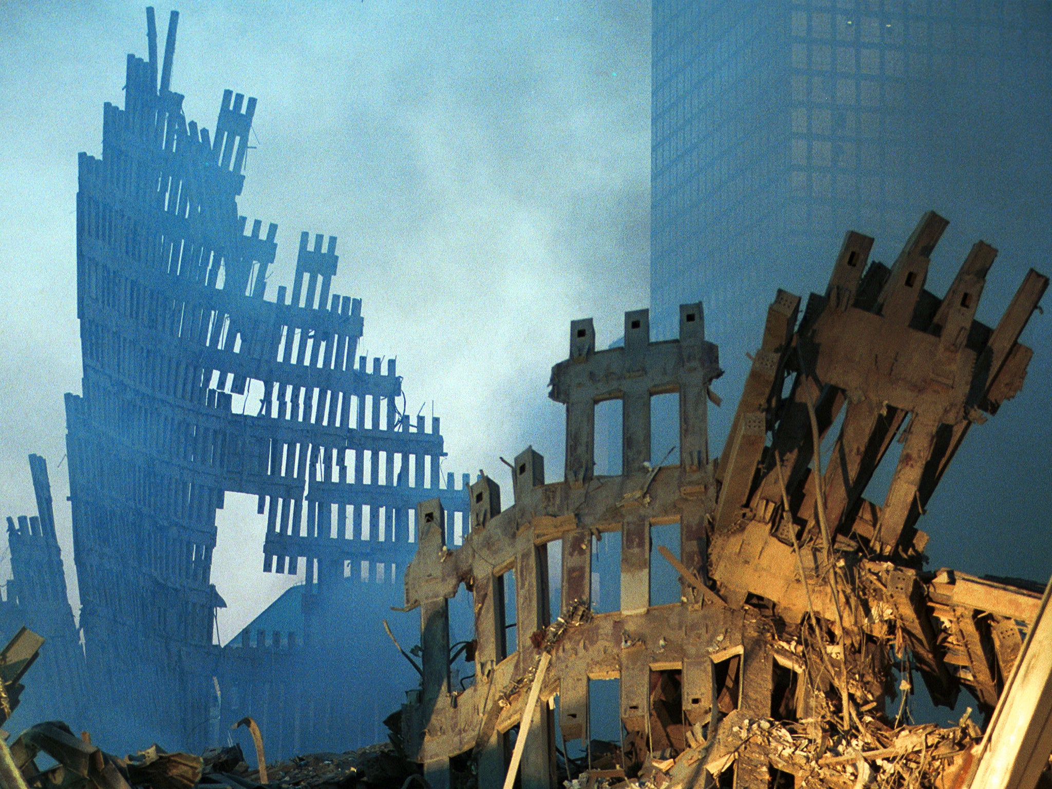 Smoke and wreckage of the World Trade Centre two days after the terrorist attack (Getty)