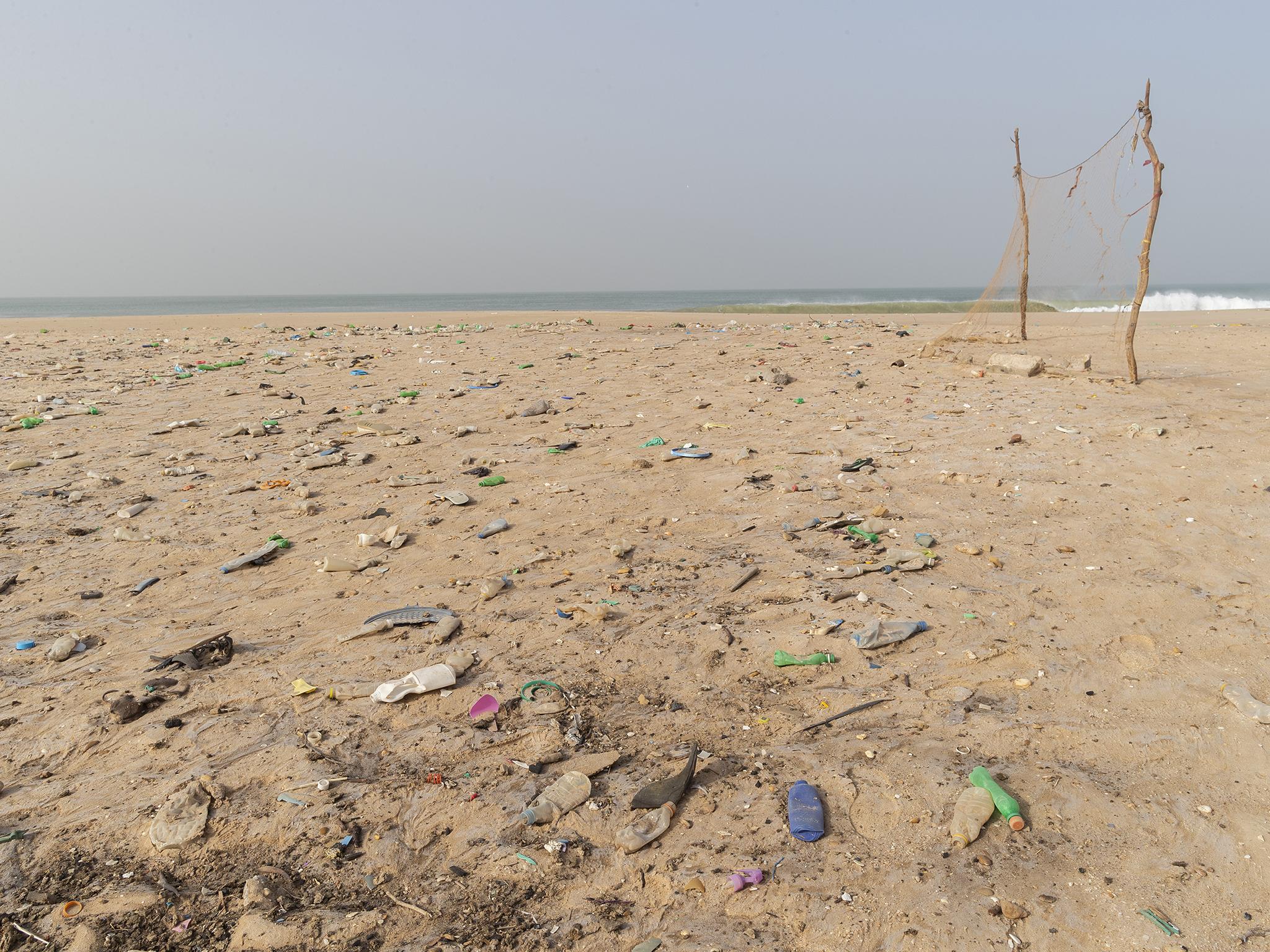 A polluted beach with plastics in the fishing village Yenne Todd, Senegal, 25 February 2019. Senegal is choking on plastic waste with tens of thousands of tons of it ending up in the ocean every year. A problem that is not only threatening the coastal population but also the economy. Due to a lack of comprehensive municipal waste management mechanisms communities have engaged in their own clean ups in some villages. Environmentalists urge a change of policy regarding the use of plastics is urgently needed by government.