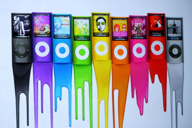 An ad shows colors of the new iPod Nano as Apple CEO Steve Jobs speaks during a special event September 9, 2008 in San Francisco, California