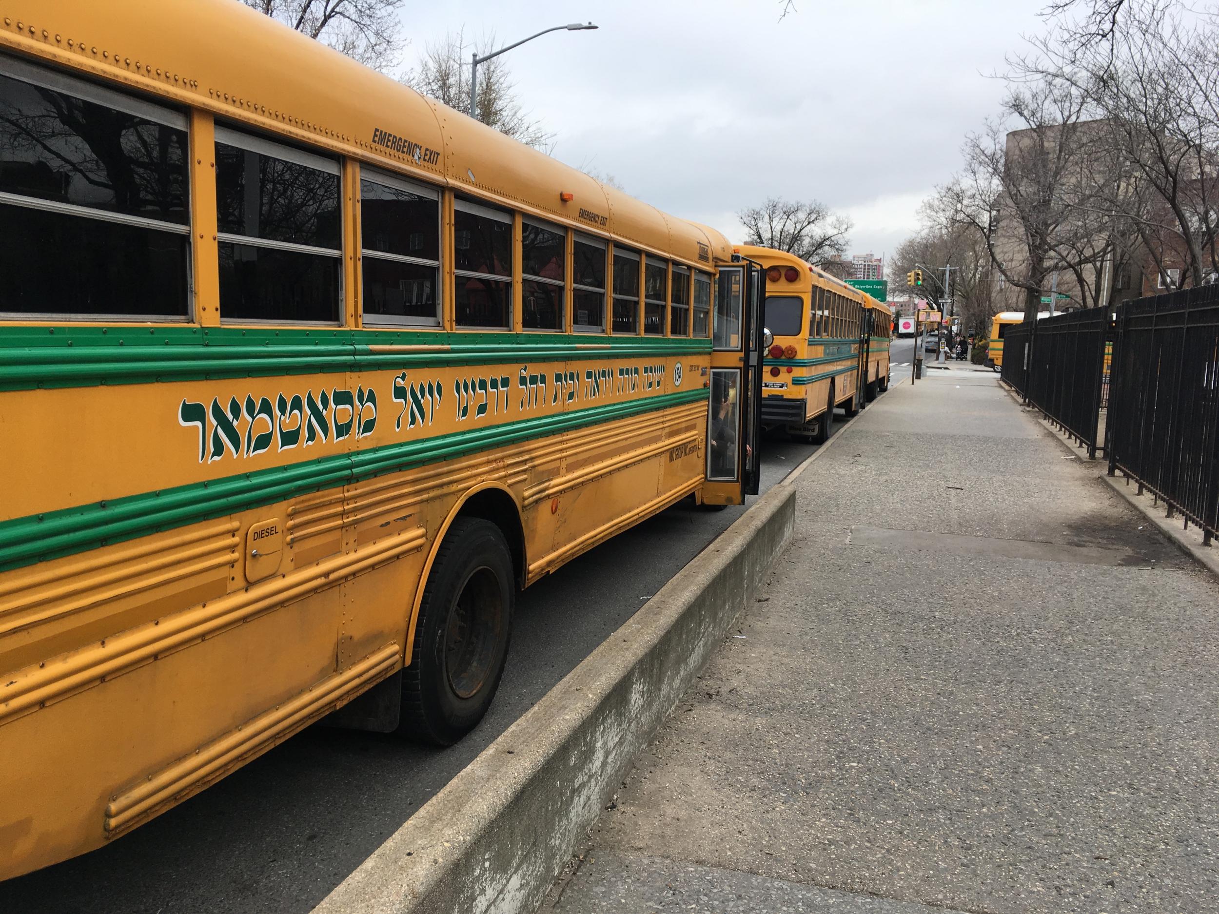 School buses with Yiddish writing on the sides in Williamsburg