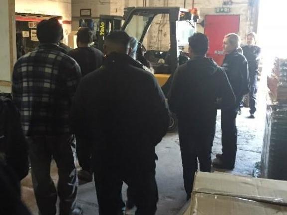 Officers interview workers at Smethwick factory