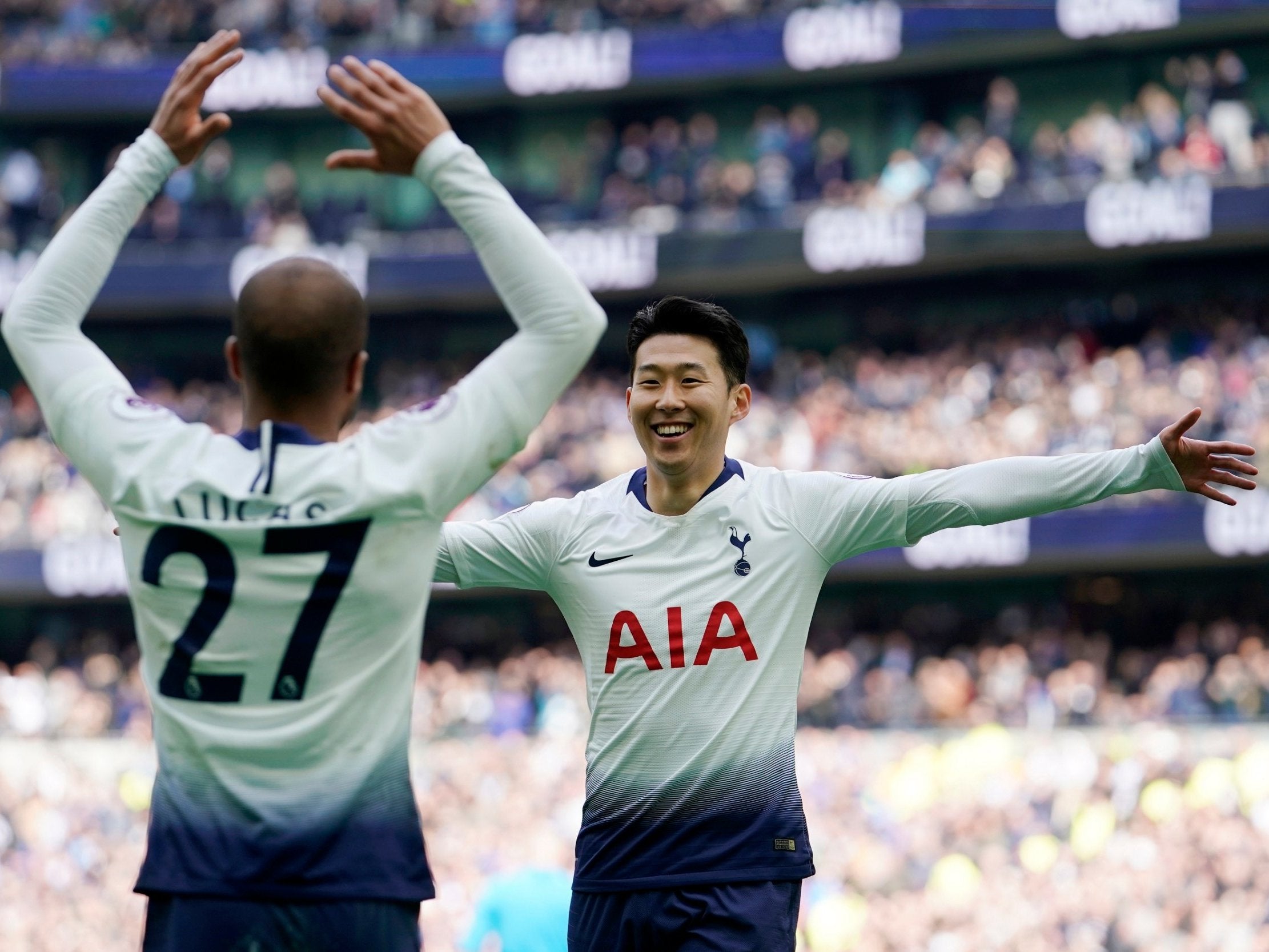 Son Heung-min, right, celebrates with Lucas Moura against Huddersfield
