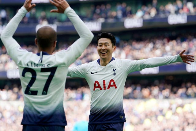 Son Heung-min, right, celebrates with Lucas Moura against Huddersfield