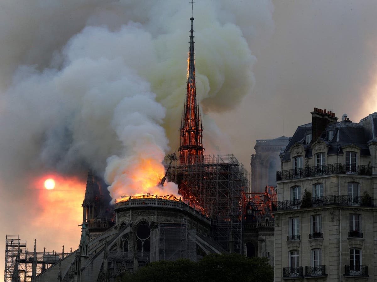 Notre Dame cathedral fire: Video shows moment centuries-old spire collapses in huge blaze