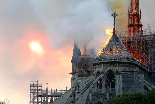 Flames burn the roof of the landmark Notre-Dame Cathedral in central Paris on 15 April, 2019.