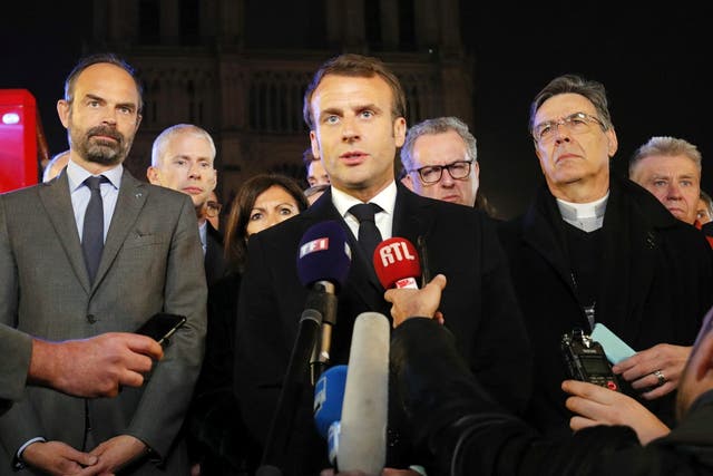 Emmanuel Macron speaks near the Notre Dame cathedral