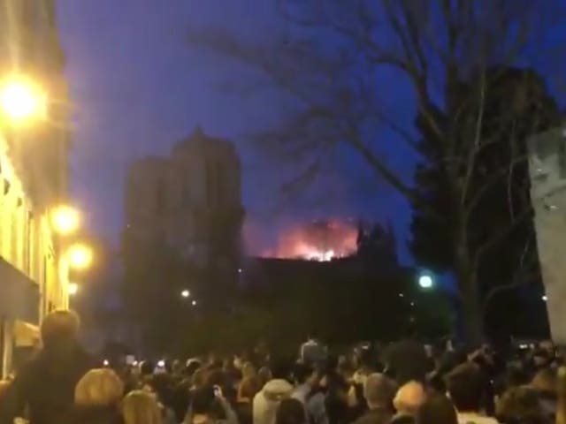 Moving moment crowd sings Ave Maria amid Notre Dame fire as sun goes down in Paris