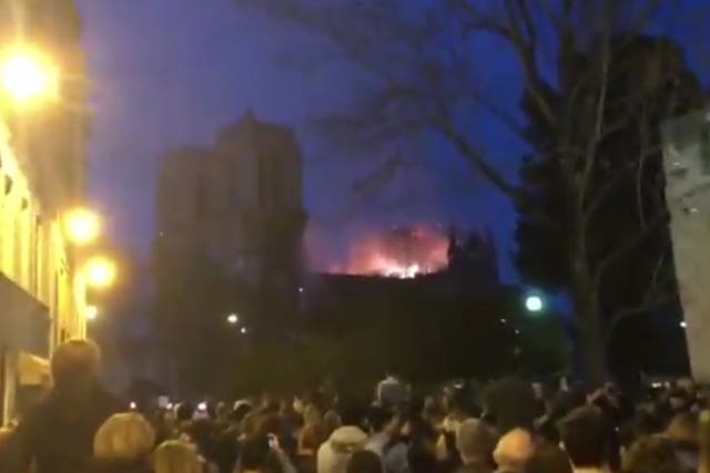 Moving moment crowd sings Ave Maria amid Notre Dame fire as sun goes down in Paris