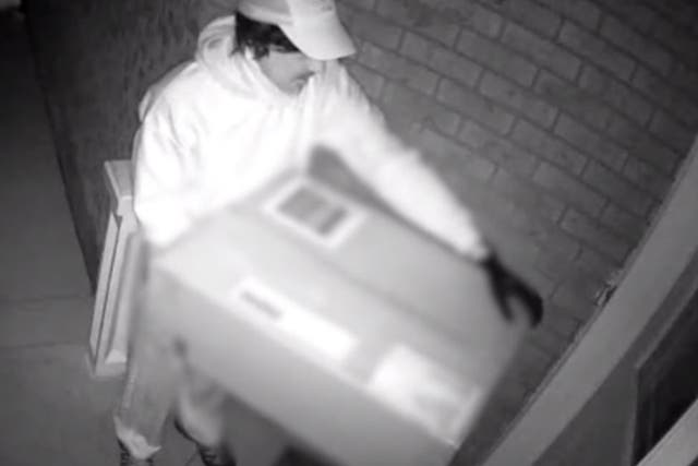 A suspected hitman allegedly attacked a woman with crossbow hidden in a delivery package