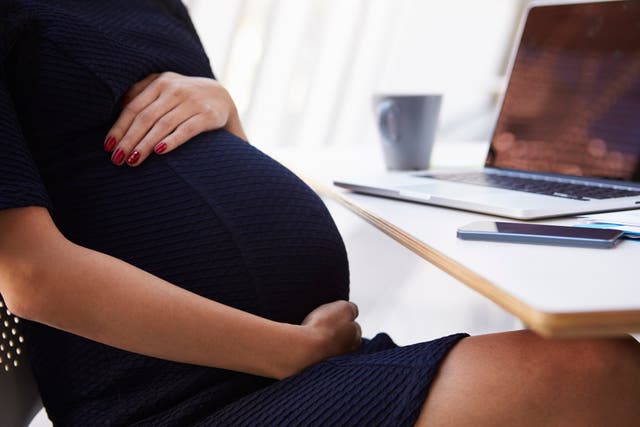 Close Up Of Pregnant Businesswoman In Office