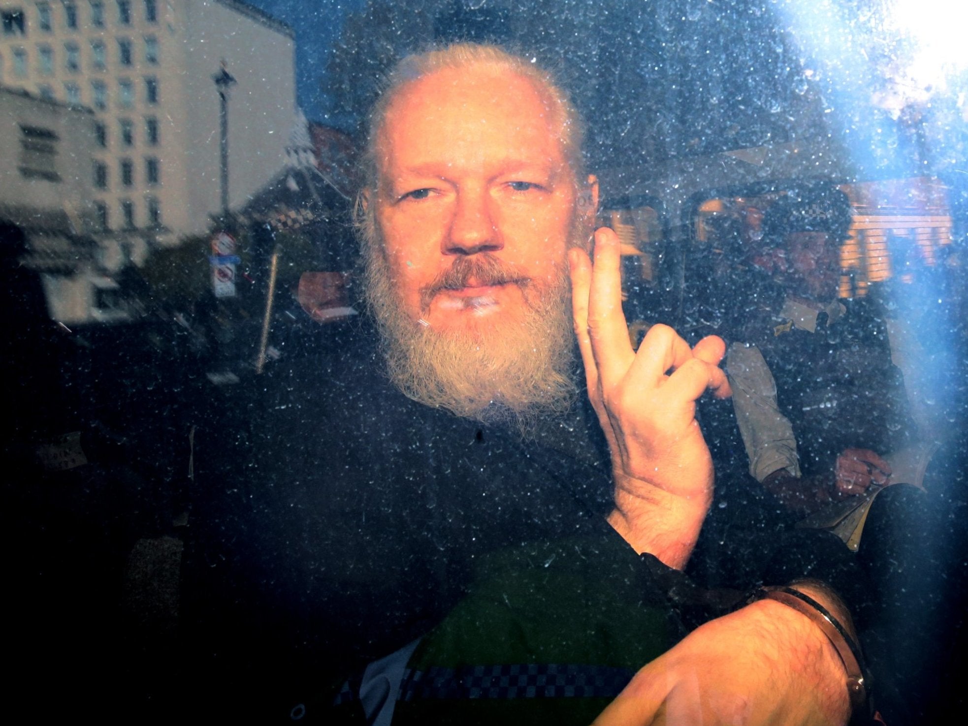 Julian Assange inside a police vehicle on his arrival at Westminster Magistrates’ Court last week.