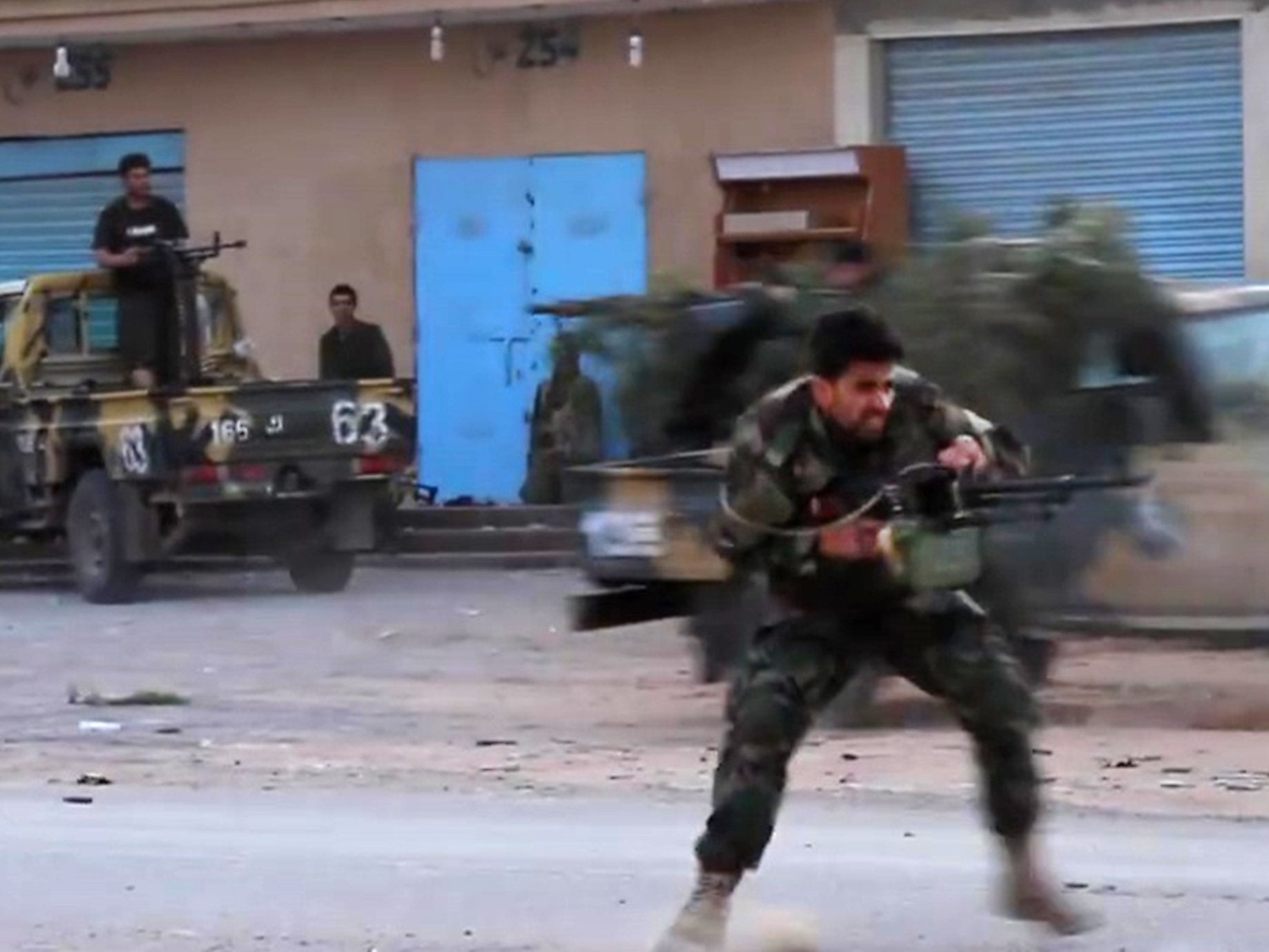 Screengrab from a video published on the LNA’s War Information Division’s Facebook page on 16 April shows a fighter running while firing a machine gun reportedly in a southern suburb of Tripoli