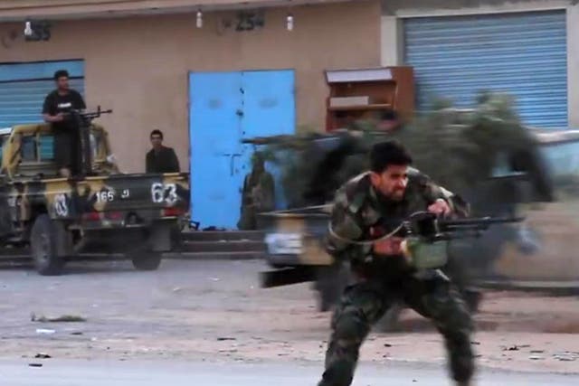 Screengrab from a video published on the LNA’s War Information Division’s Facebook page on 16 April shows a fighter running while firing a machine gun reportedly in a southern suburb of Tripoli