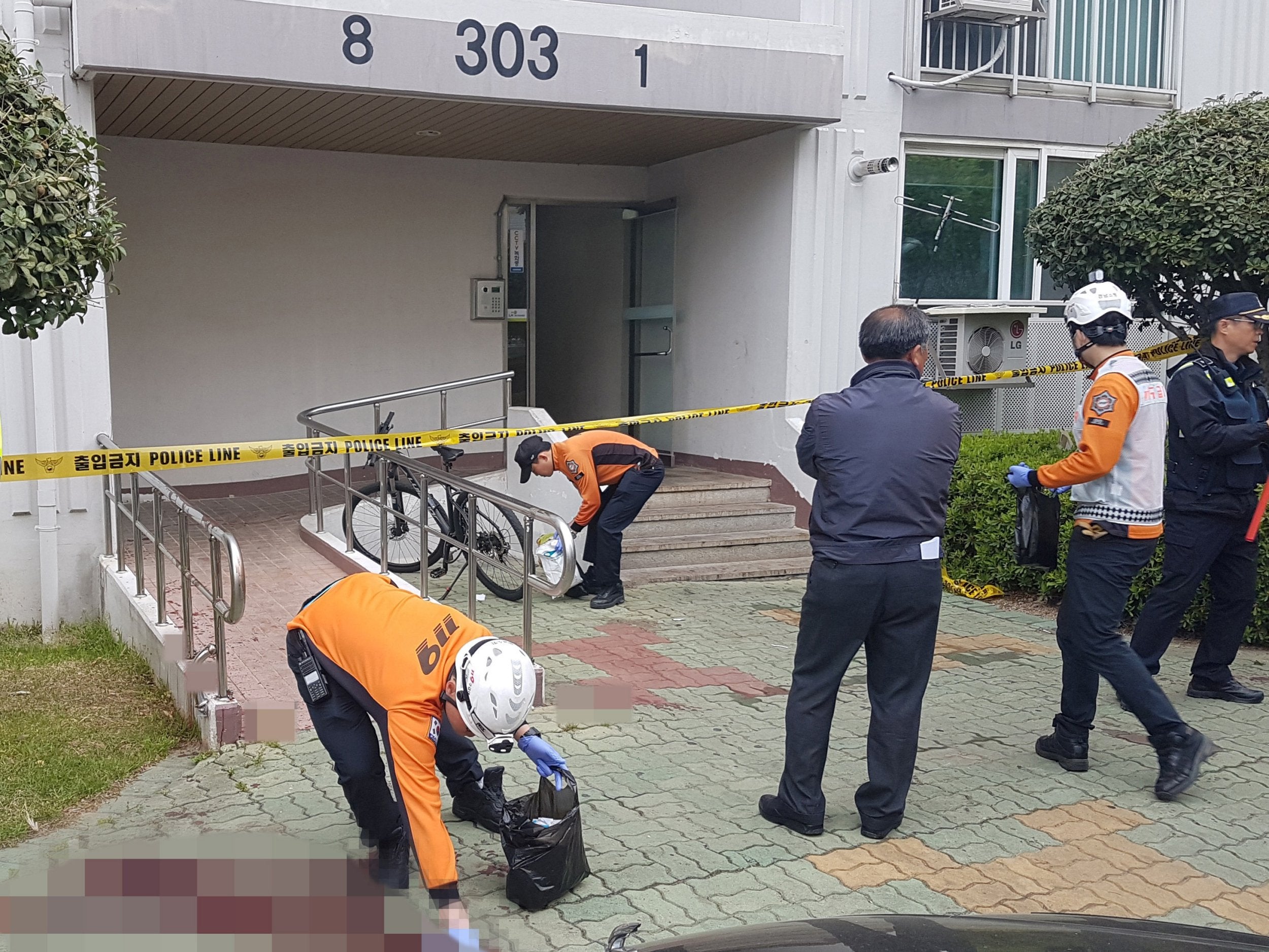 A view of the scene where, according to police, a man set fire to his own apartment then fatally stabbed five people who tried to flee the blaze, in Jinju, South Korea