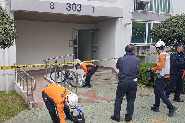 A view of the scene where, according to police, a man set fire to his own apartment then fatally stabbed five people who tried to flee the blaze, in Jinju, South Korea