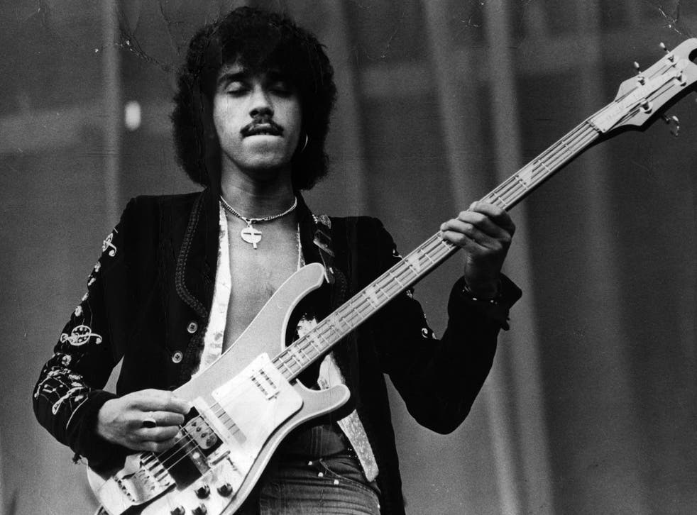 Phil Lynott, singer and bass guitarist with Thin Lizzy, performs in 1976