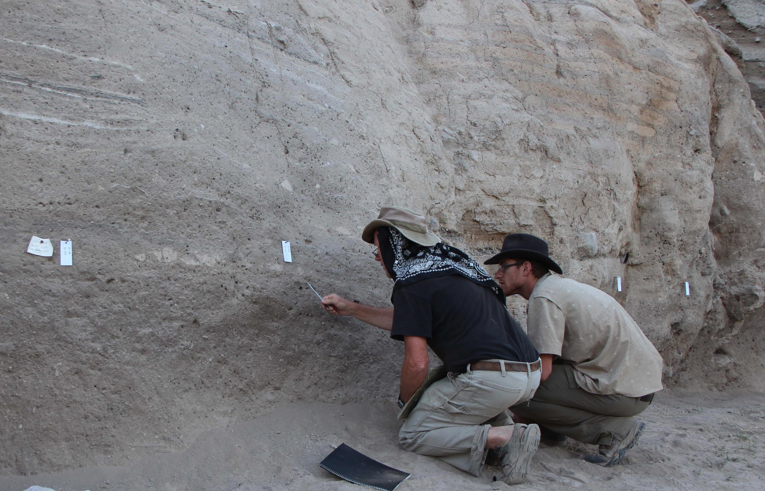 Study authors Jay Quade (left) and Jordan Abell (right) looking for optimal samples at the site of an ancient Turkish settlement where salts left behind by animal and human urine give clues about the development of livestock herding.